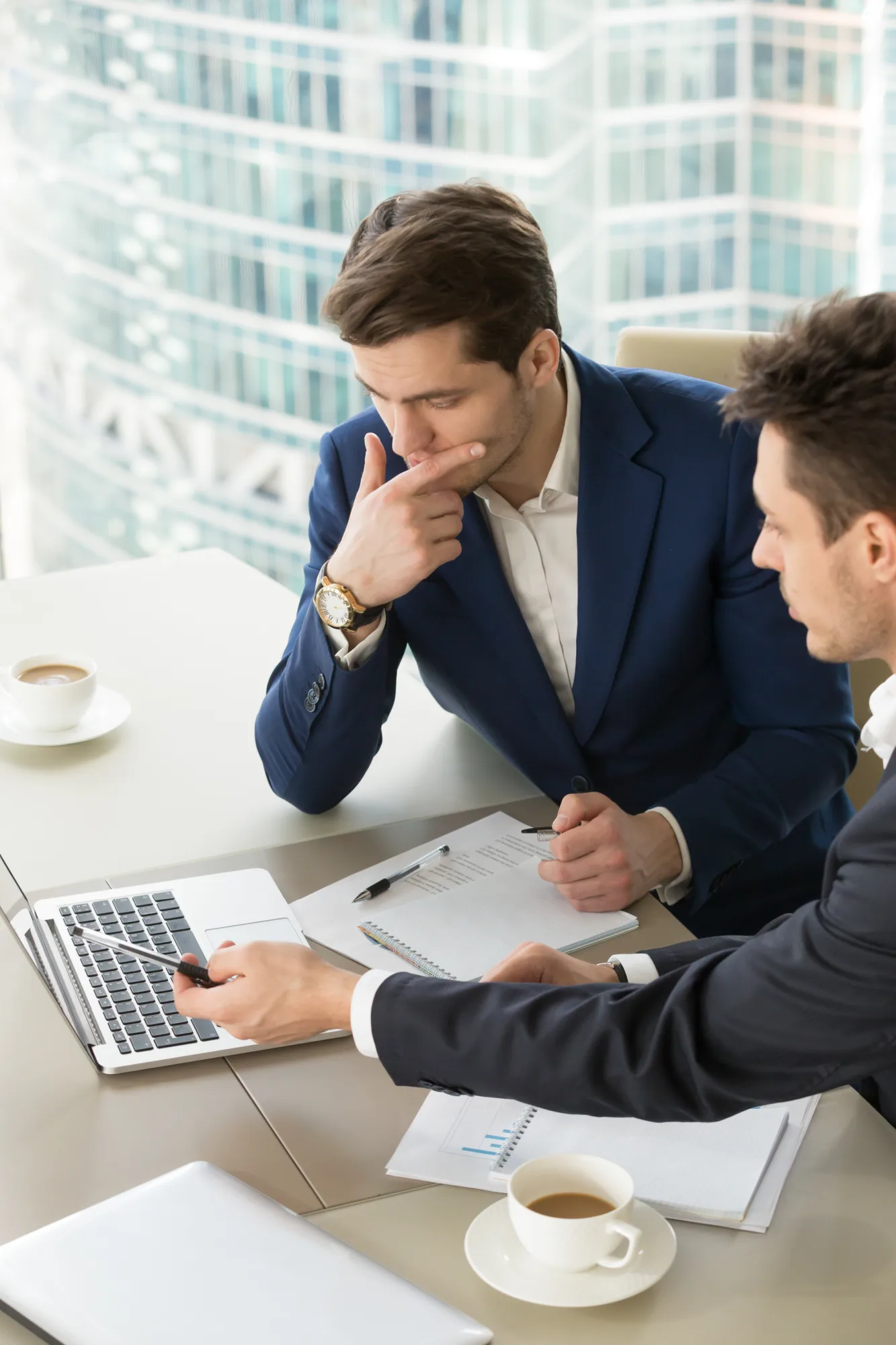 Entrepreneurs discussing work results in a meeting, illustrating hands-on retail leadership and strategy